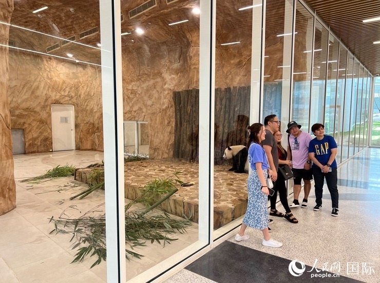 當(dāng)?shù)赜慰团c“四?！焙嫌?。人民網(wǎng)記者 張志文攝